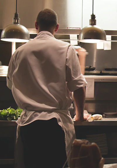 Cook in the professional kitchen of a restaurant